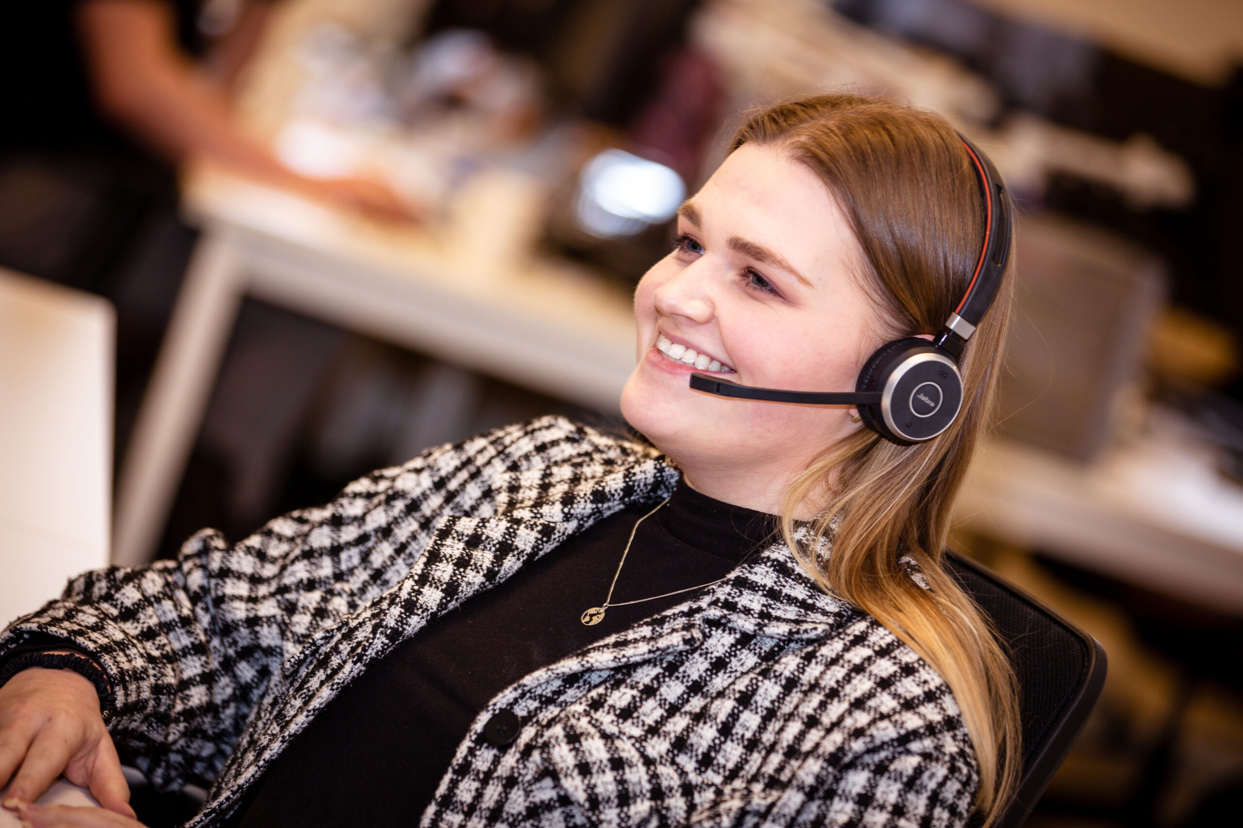 Elite Office member working with a headset on
