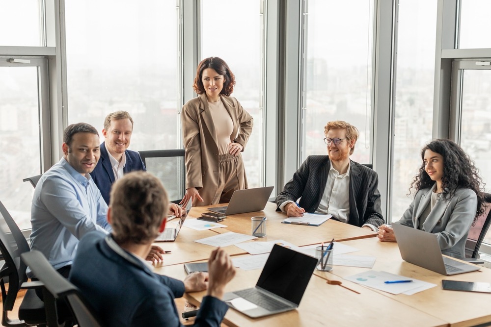 Office meeting employees using Microsoft services