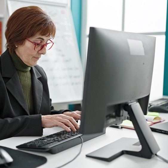 School teacher using education IT systems